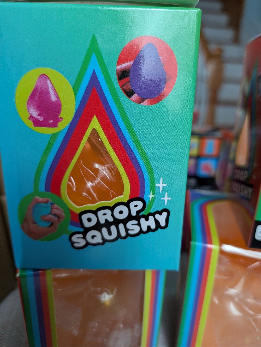 Drop Squishy In Orange, 🧡 🩷 💜 and 💙. Off Brand Not Needoh but Does The Trick